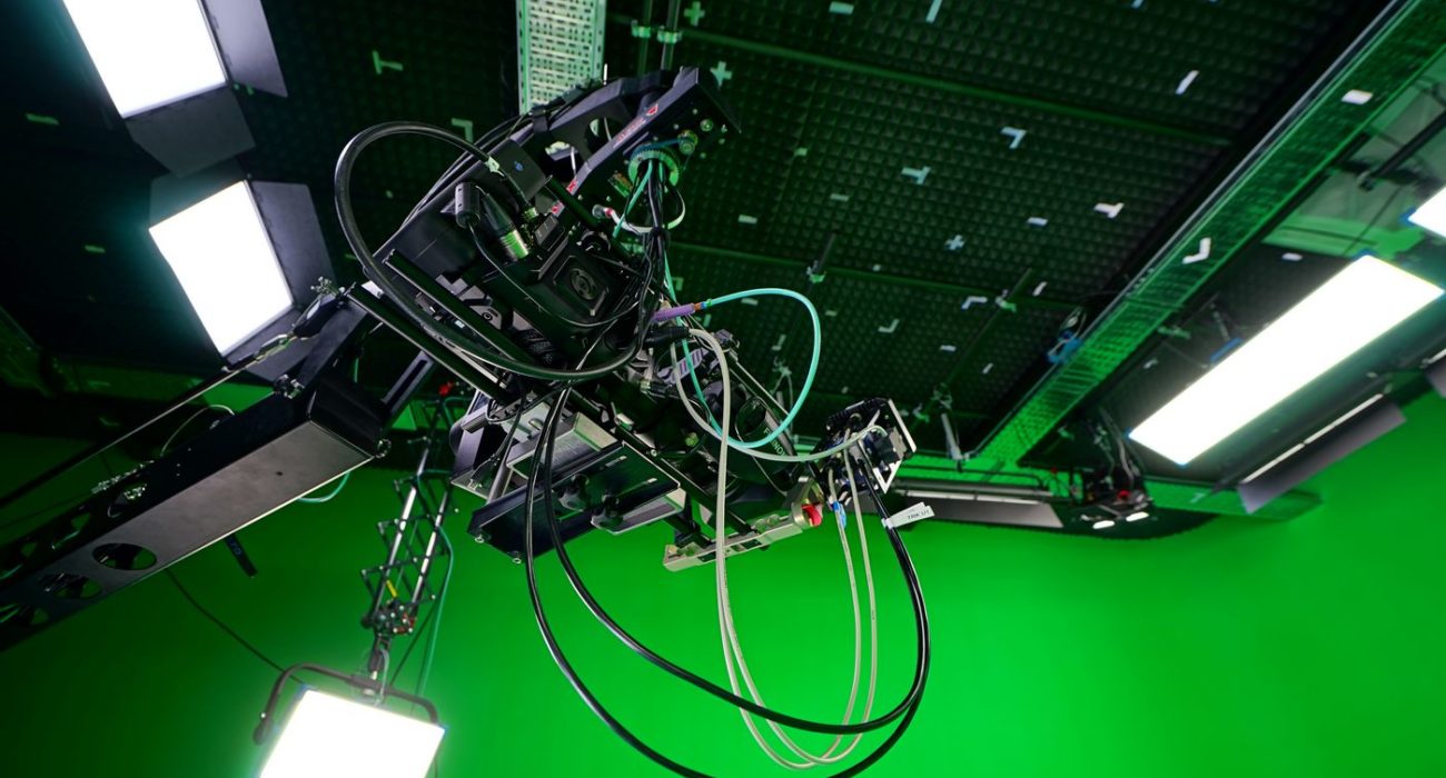 Blackmagic ursa with fujinon lens and Tilta Nucleus-M in green screen studio for virtual production and vfx with trackman ceiling markers and Arri Lig